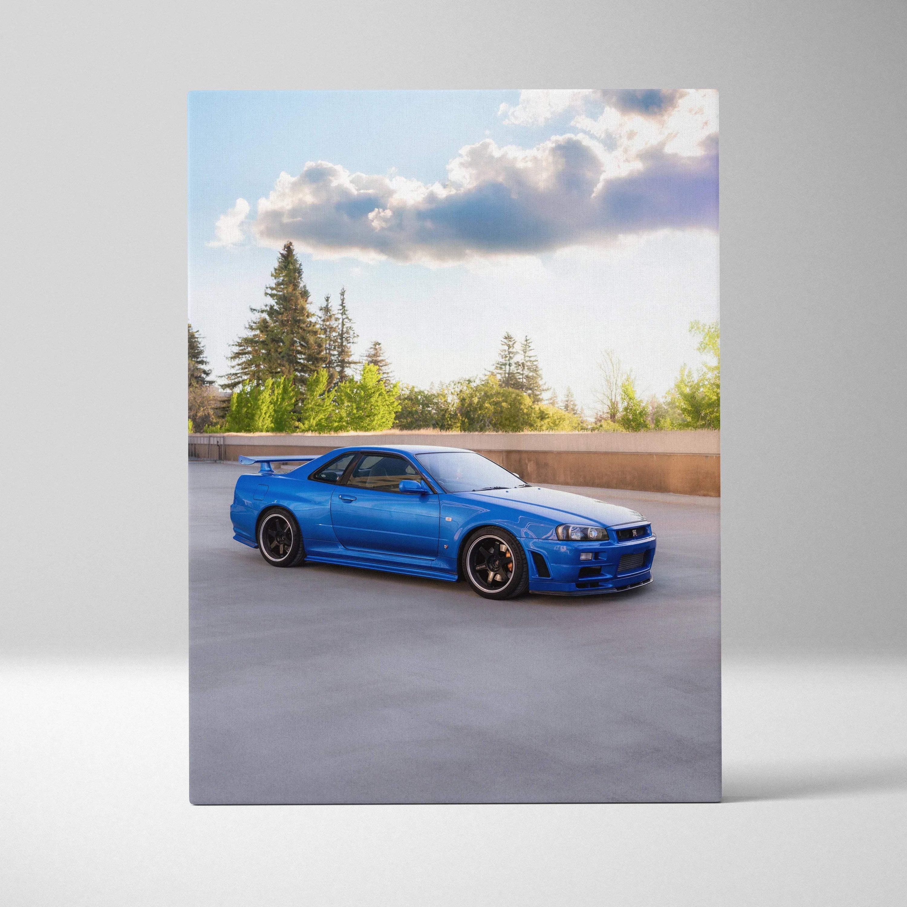 Blue Nissan R34 GTR parked outdoors with trees and clouds, vertical canvas wall art.
