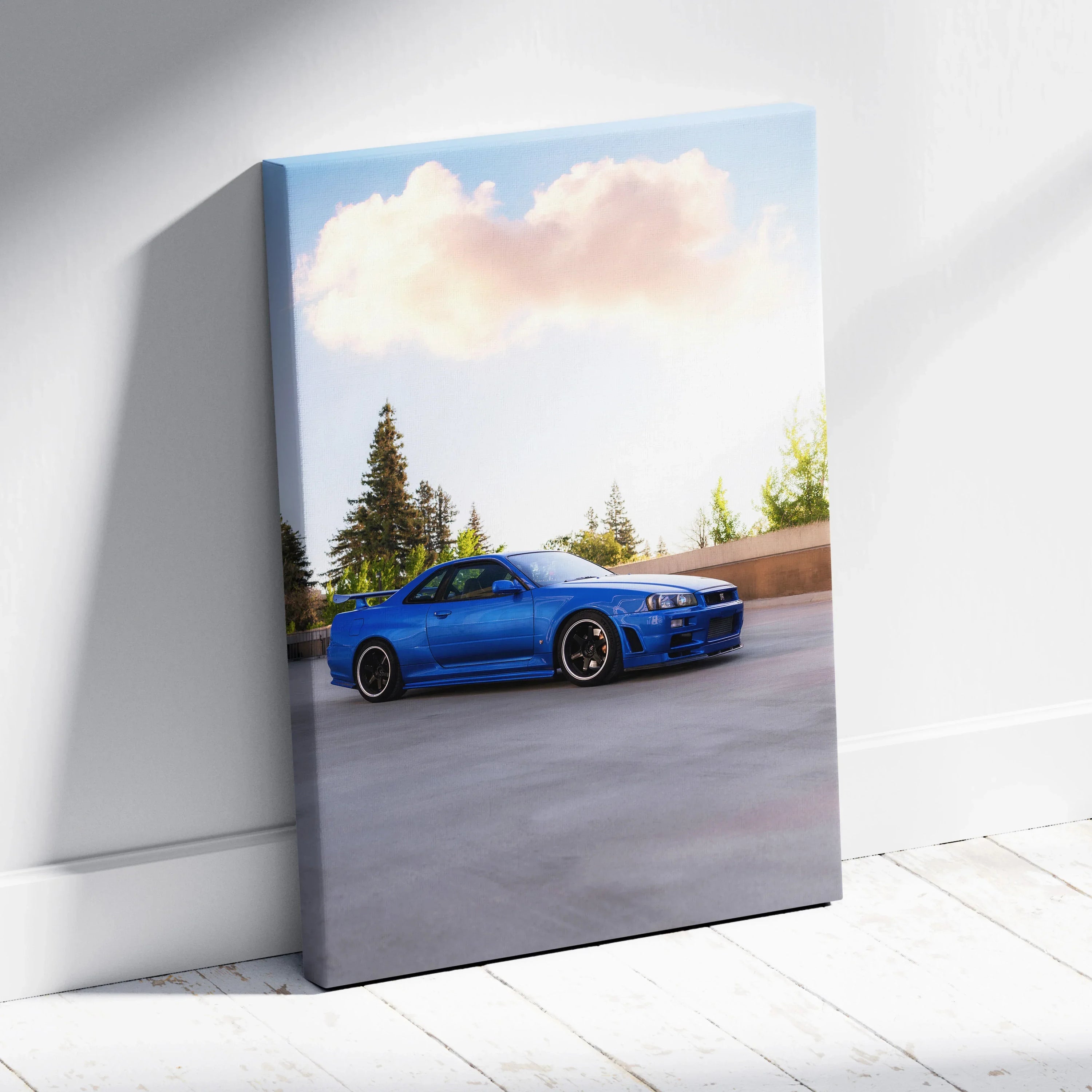 Blue Nissan R34 GTR on canvas wall art with forest and sky background, vertical canvas art.