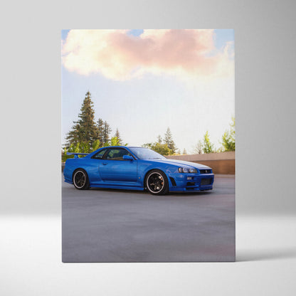 Nissan R34 GTR blue sports car on vertical canvas wall art with outdoor background and pine trees.