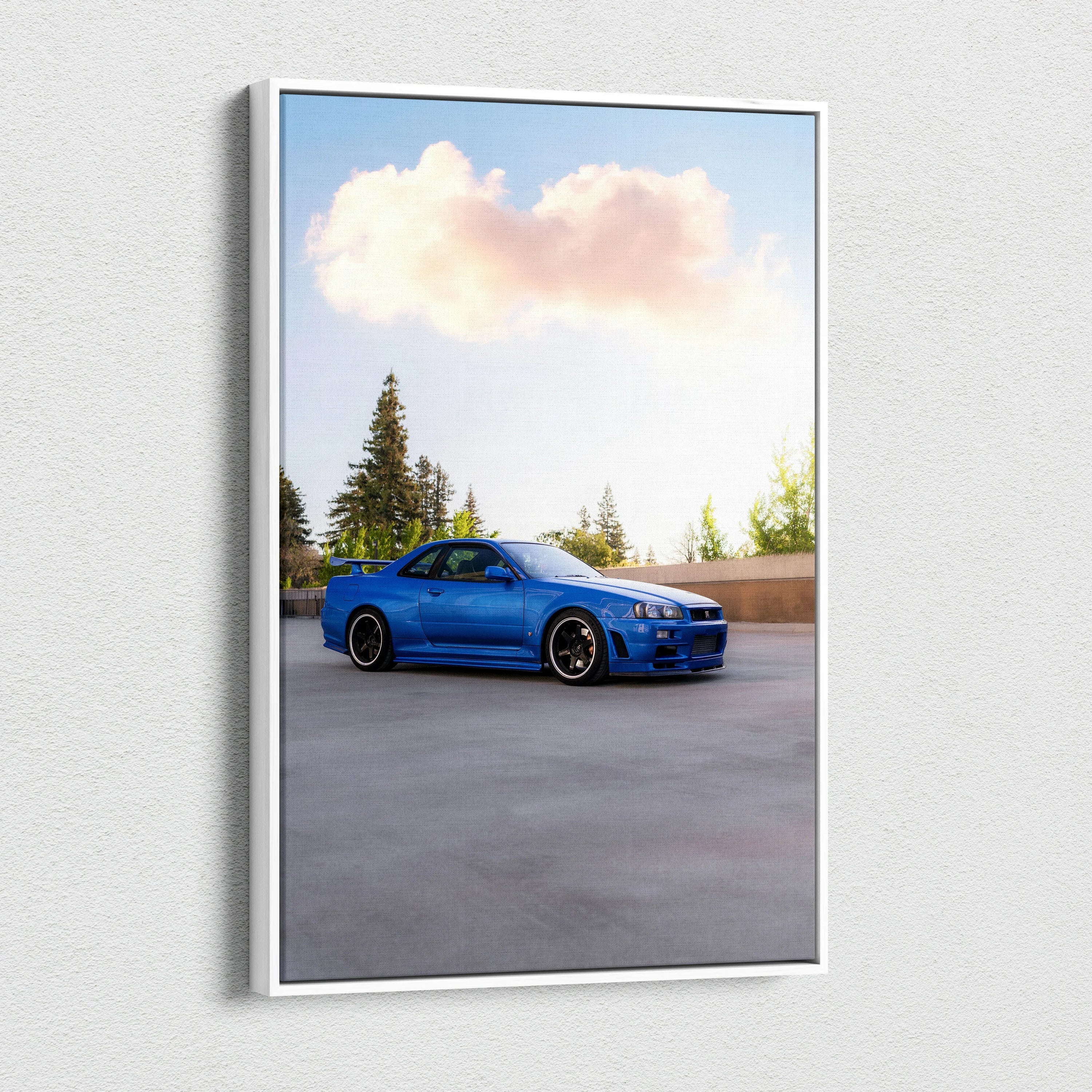 Blue Nissan R34 GTR parked outdoors with trees background vertical canvas wall art.
