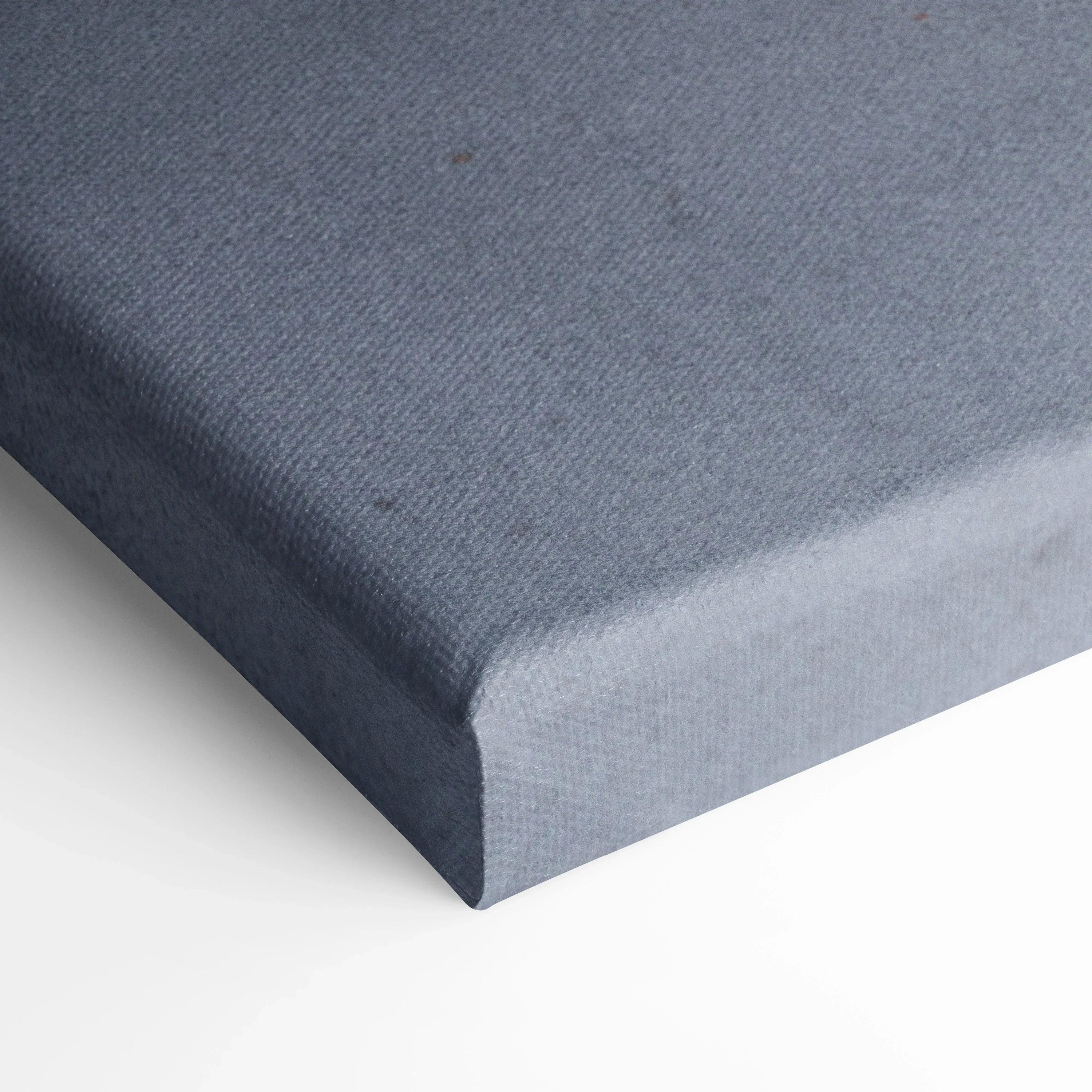 Close-up of textured gray canvas corner, showing tight stretch and clean edge for wall art display.