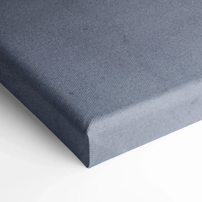 Close-up of textured gray canvas corner, showing tight stretch and clean edge for wall art display.