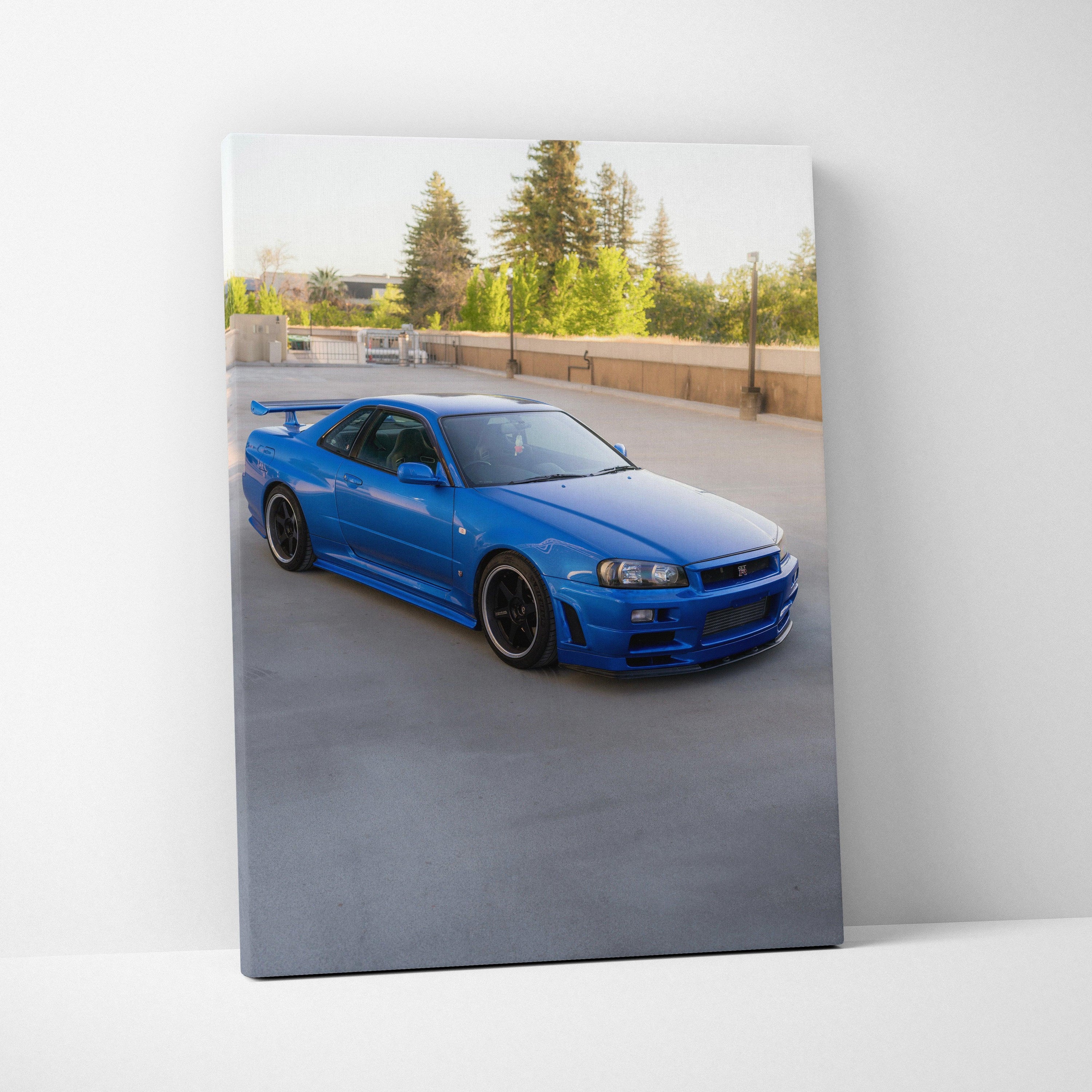 Blue Nissan R34 GTR on urban road printed on high-resolution vertical canvas wall art.