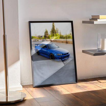 Nissan R34 GTR Skyline poster wall art with blue car parked outdoors framed in black.