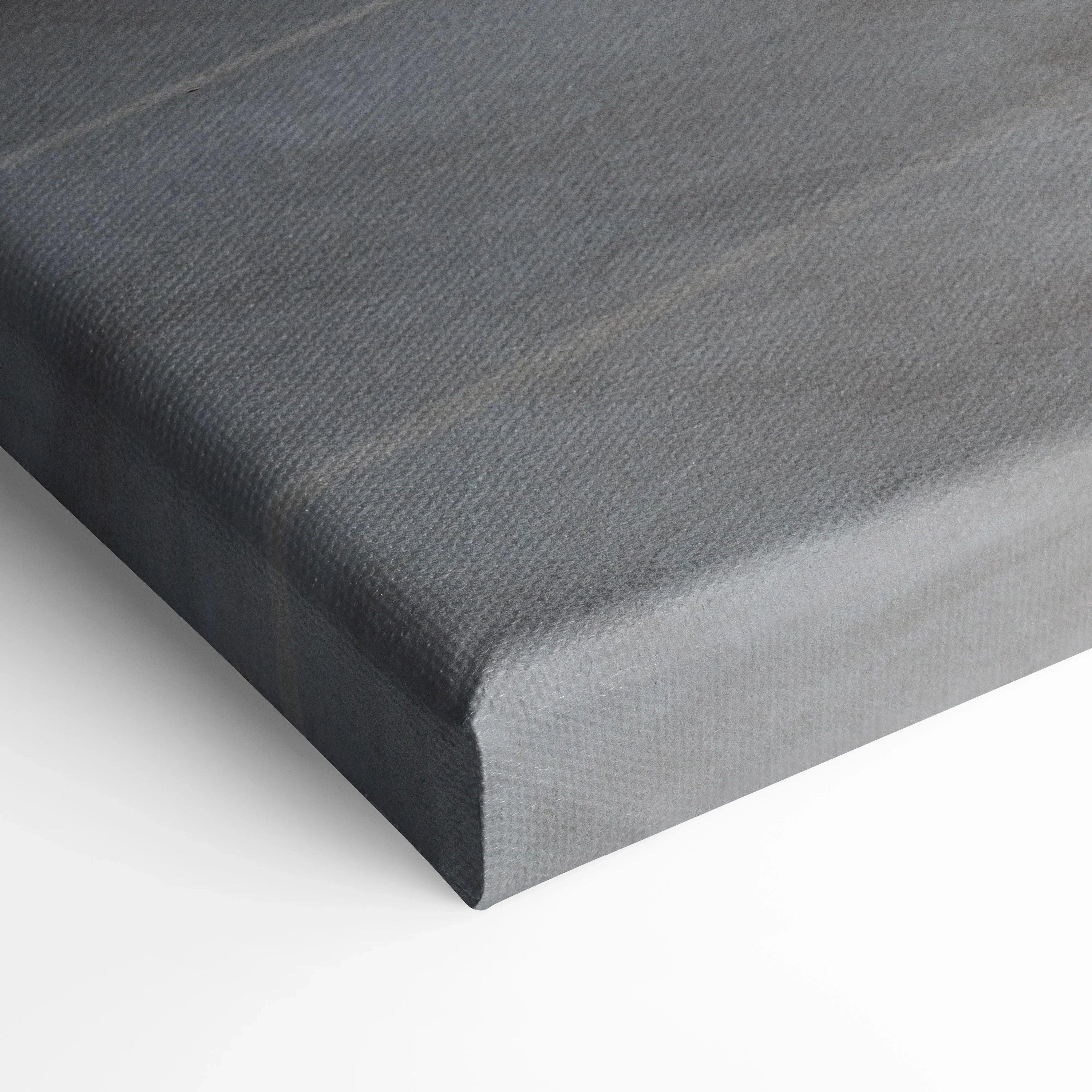 Close-up of gray canvas wall art texture and wrapped edges on vertical canvas print.