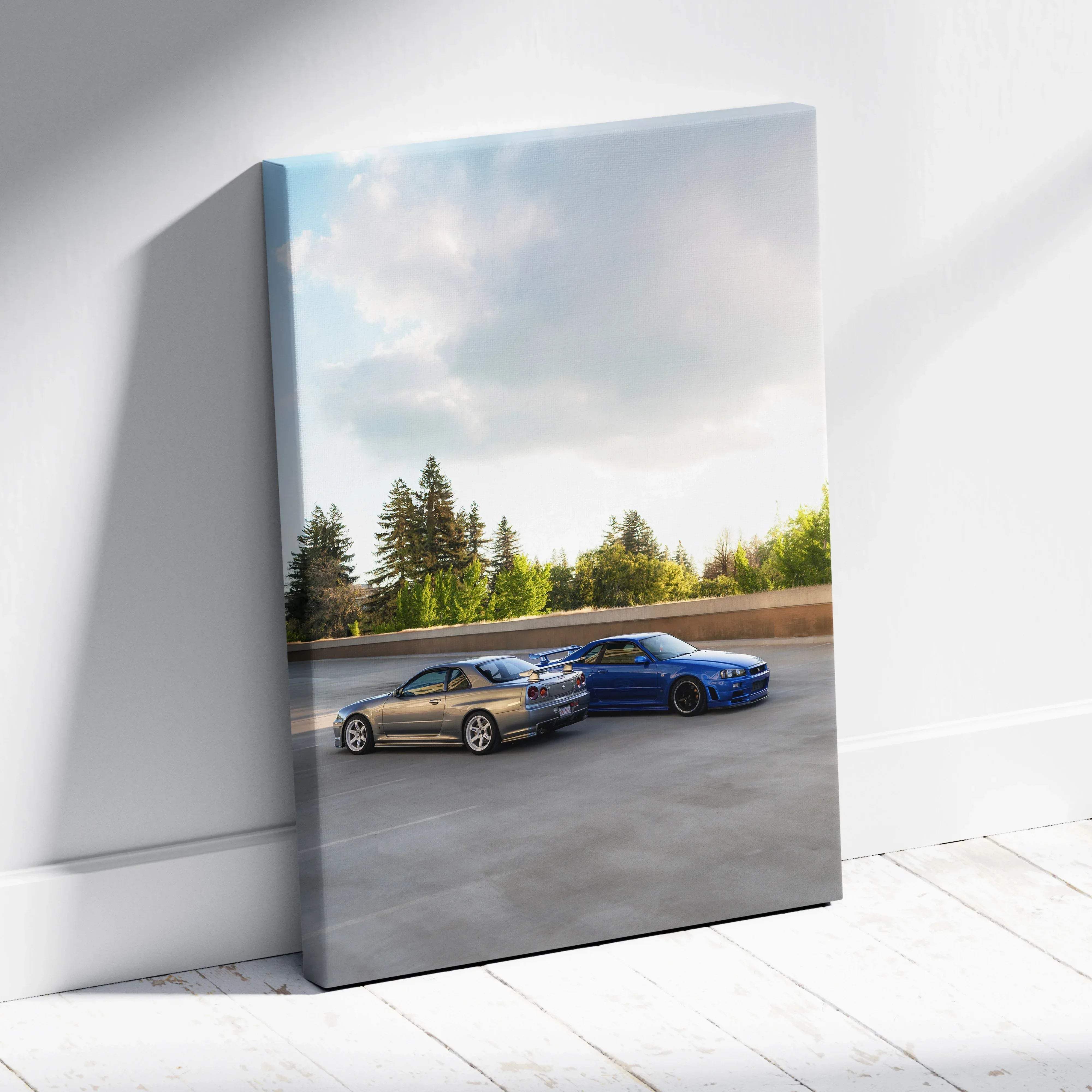 Automotive canvas wall art featuring metallic silver and vibrant blue nissan skyline r34 gtr cars in high resolution