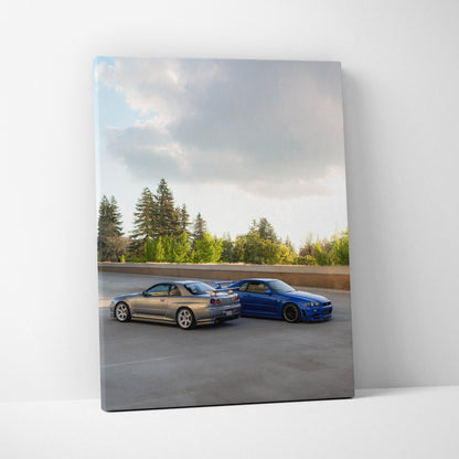Vertical canvas wall art featuring Nissan R34 GTR cars in silver and blue under a cloudy sky.