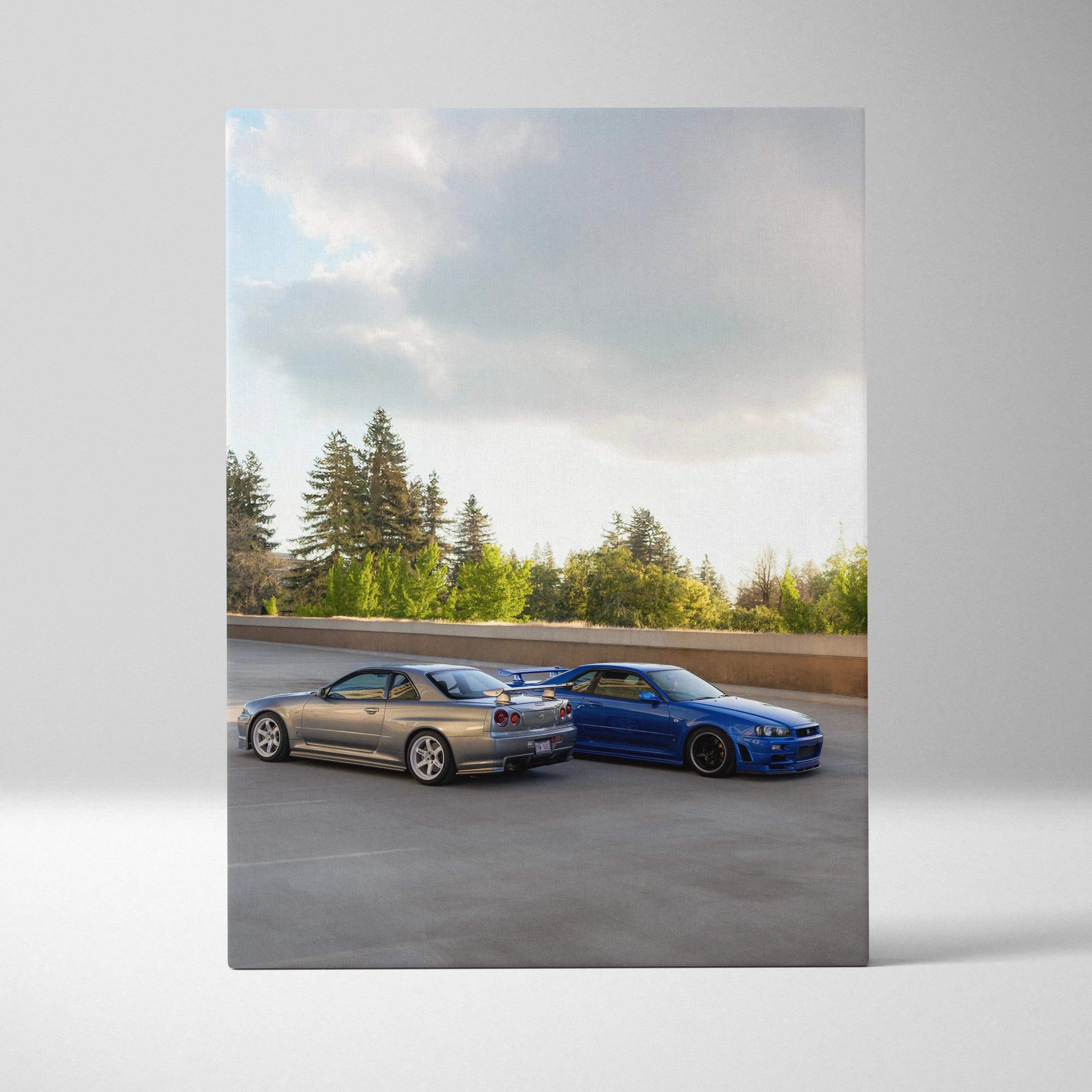 Automotive canvas wall art featuring silver and blue nissan skyline r34 gtr sports cars on asphalt road vertical print