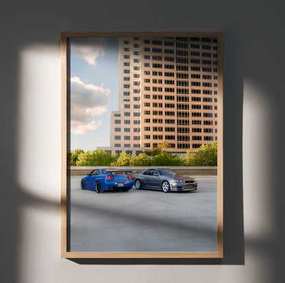 Nissan R34 GTR Skyline poster wall art with blue and silver cars in urban setting.