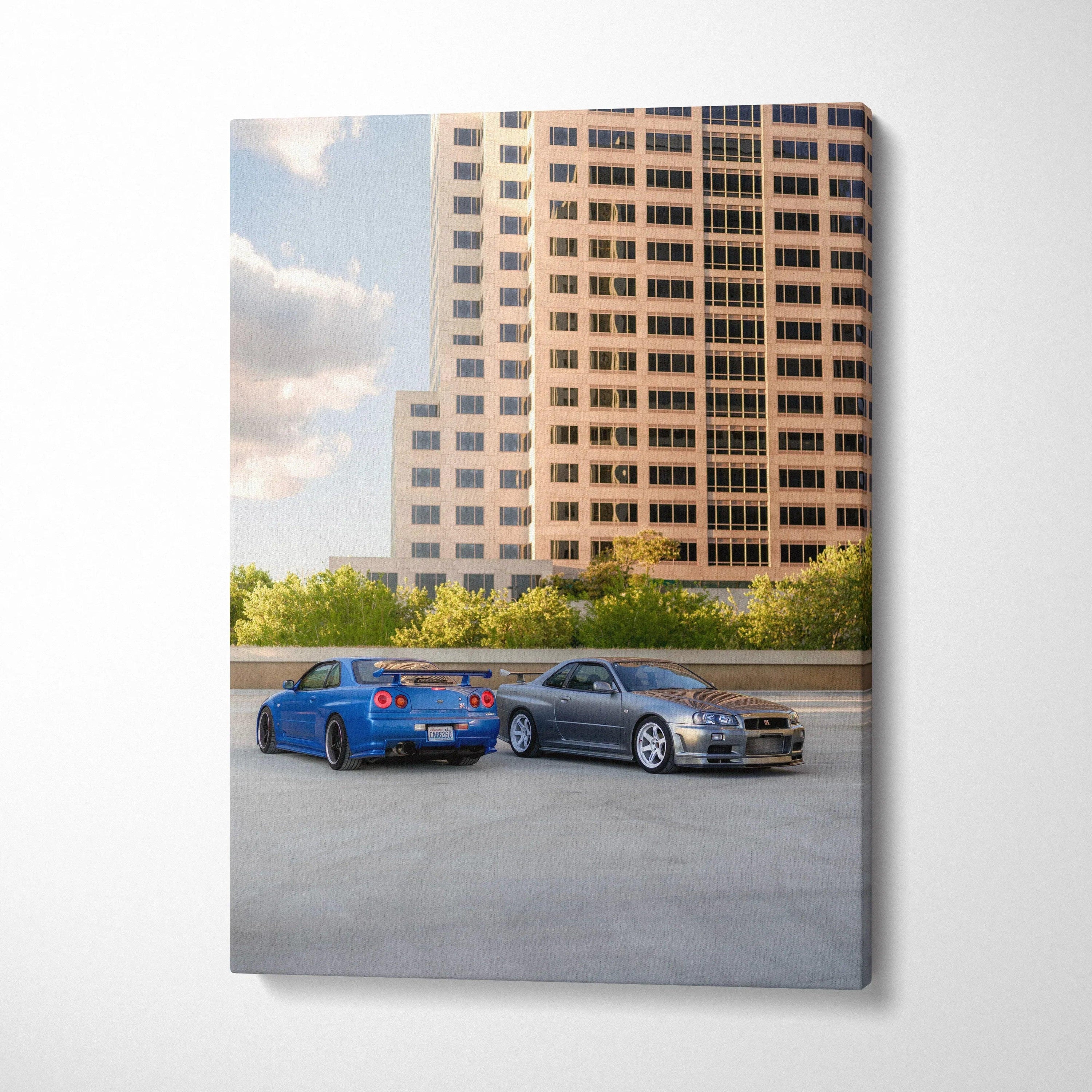 Vertical canvas art featuring two Nissan R34 GTR cars parked by a modern building, high-resolution wall art.