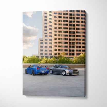 Vertical canvas art featuring two Nissan R34 GTR cars parked by a modern building, high-resolution wall art.