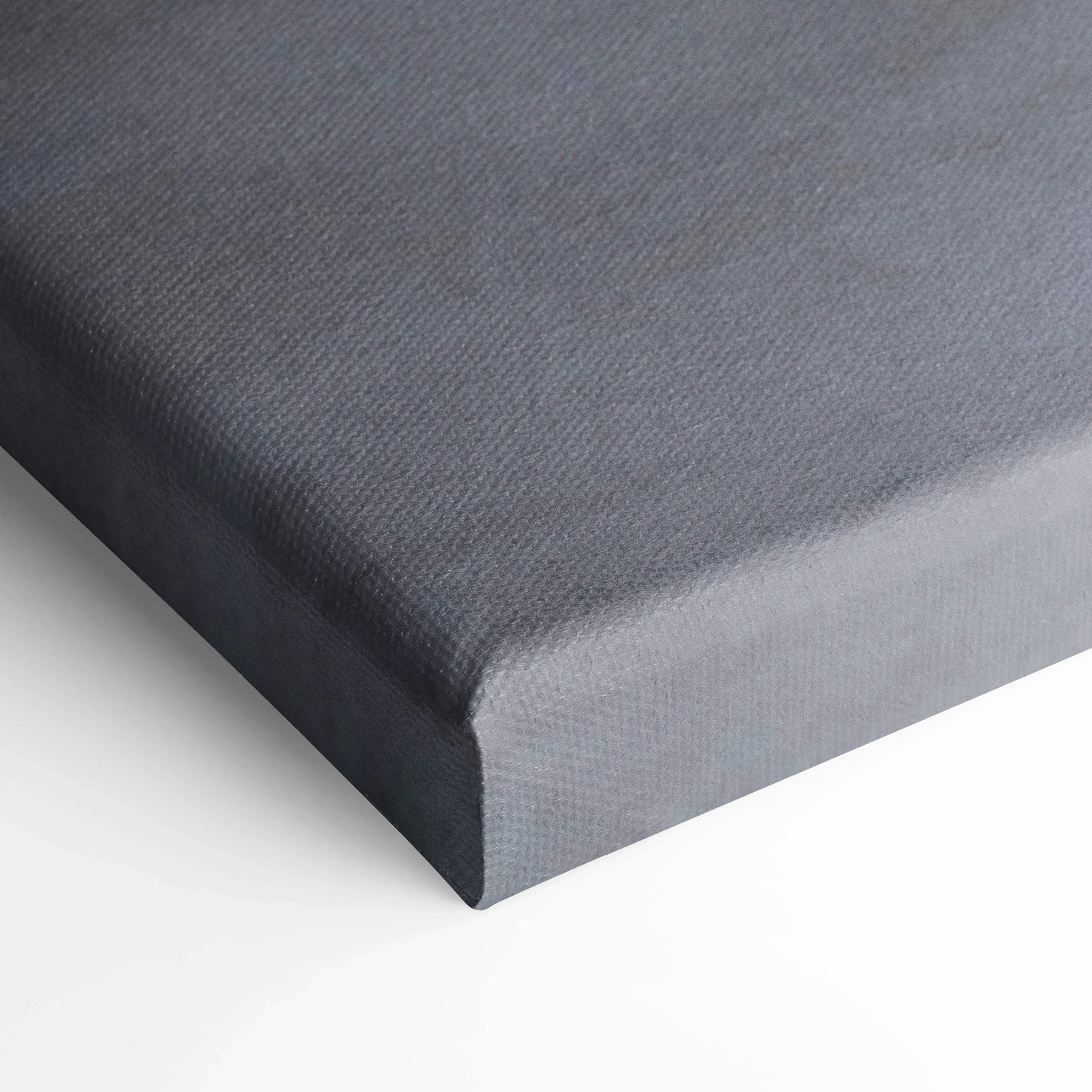 Gray textured canvas corner wrapped on wooden frame for wall art display.