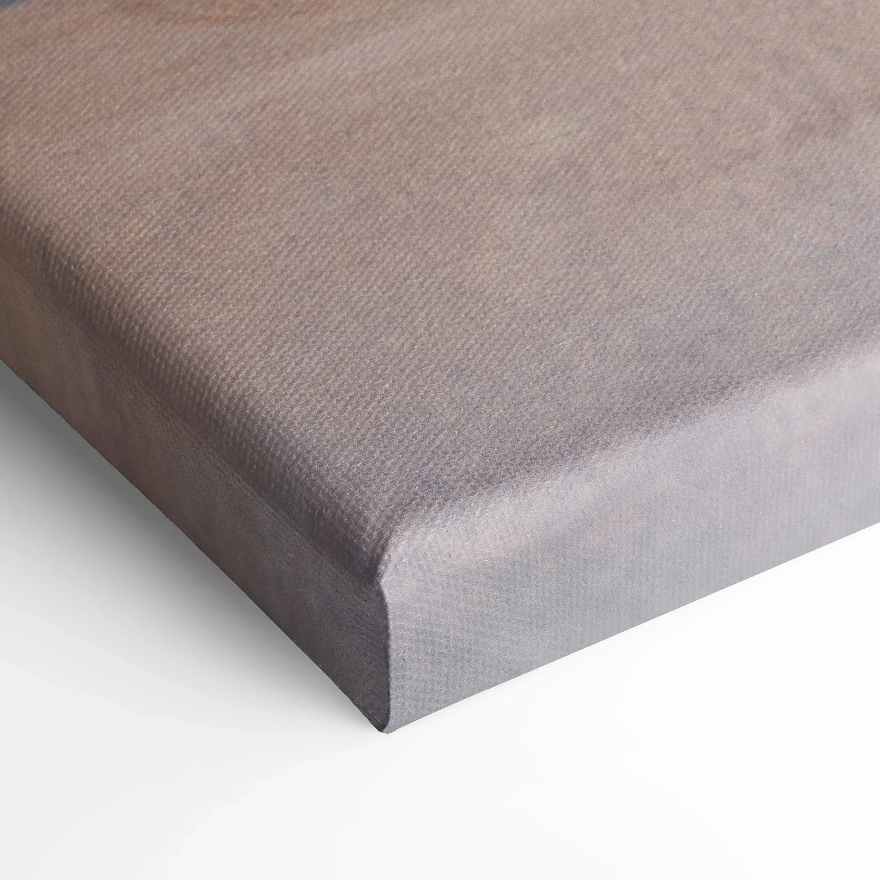 Close-up of gray textured canvas corner with tight, smooth wrapping for wall art and canvas art display.