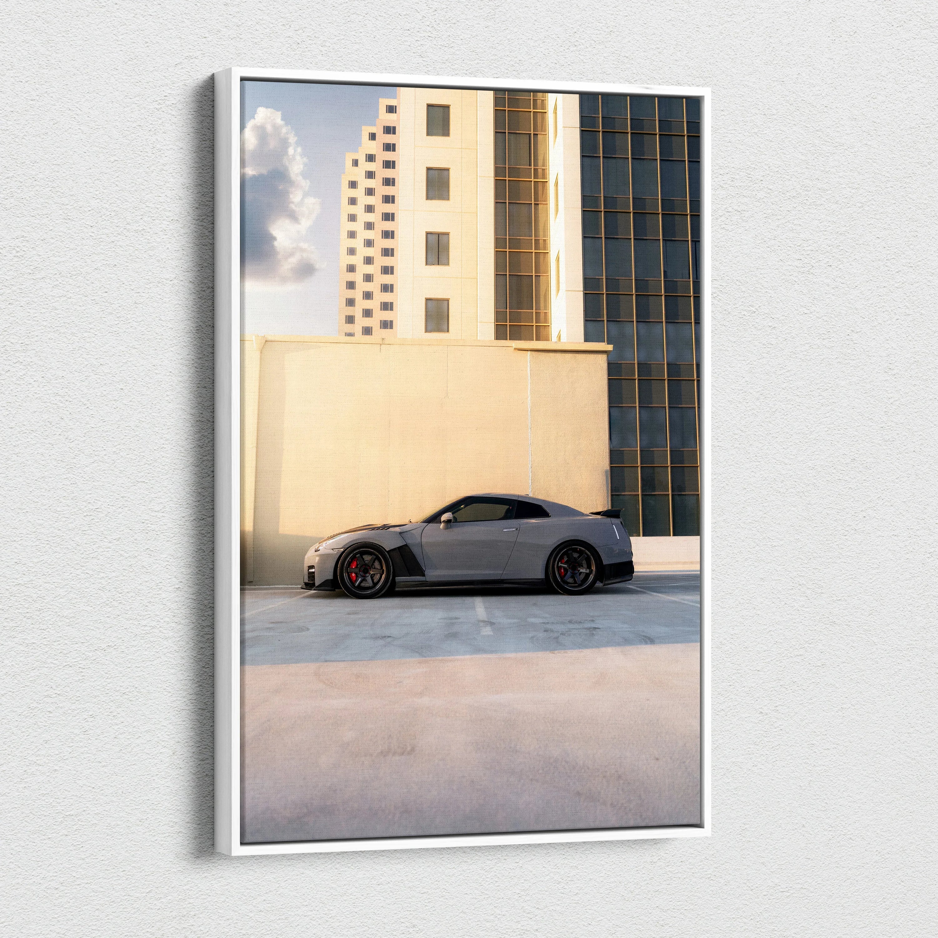 Nissan R35 GTR parked beside modern beige and glass buildings vertical canvas wall art.