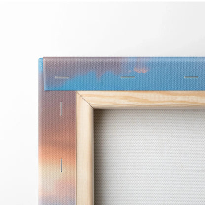 Close-up of stretched canvas corner with wooden frame and sunset gradient wall art background.