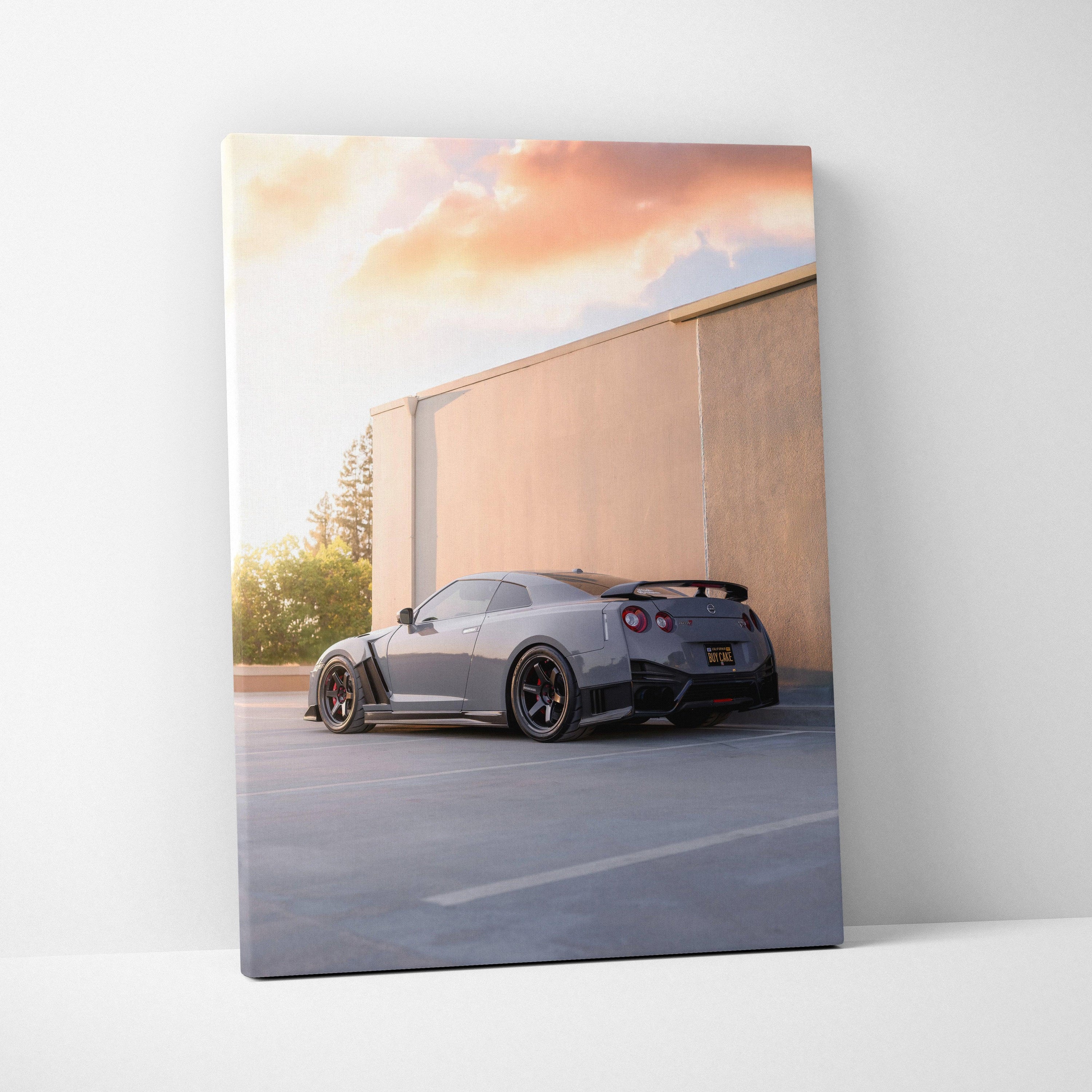 Nissan R35 GTR parked by a concrete wall at sunset canvas wall art vertical print.
