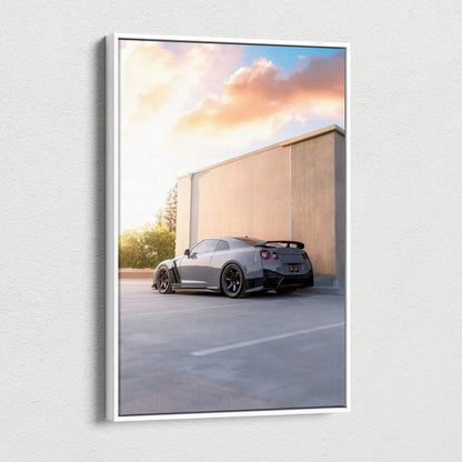 Nissan R35 GTR parked by modern wall at sunset on vertical canvas wall art.