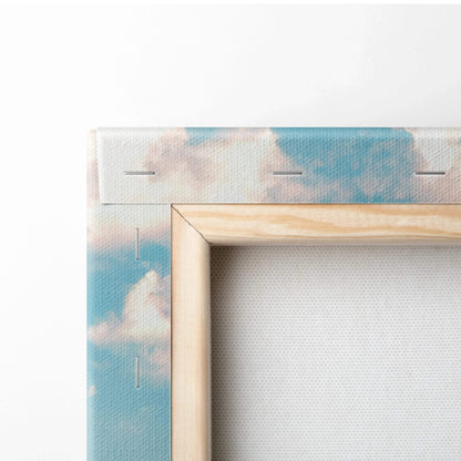 Close-up of wooden frame corner and sky print on vertical canvas wall art.