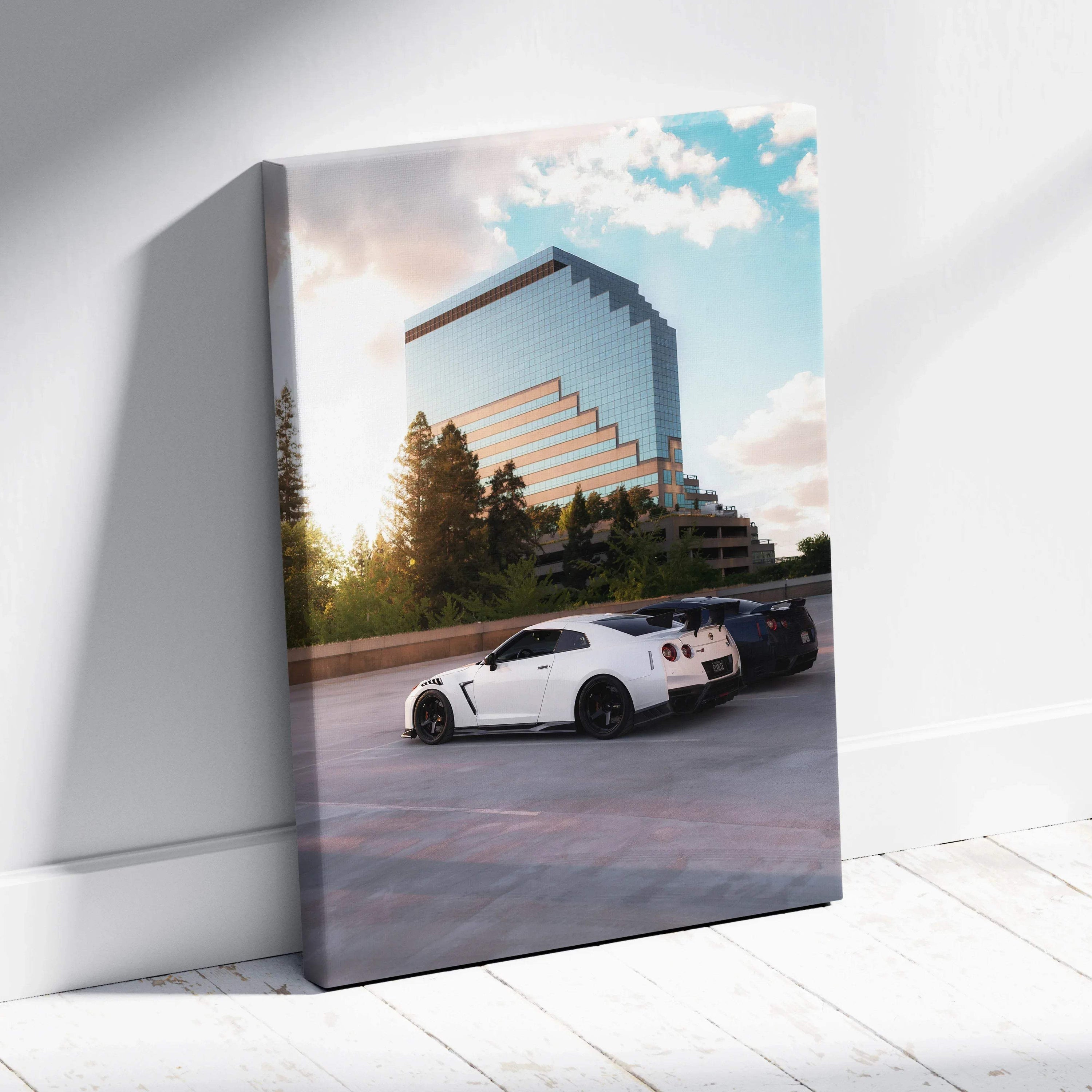 White Nissan GTR R35 parked near modern glass building at sunset vertical canvas wall art.