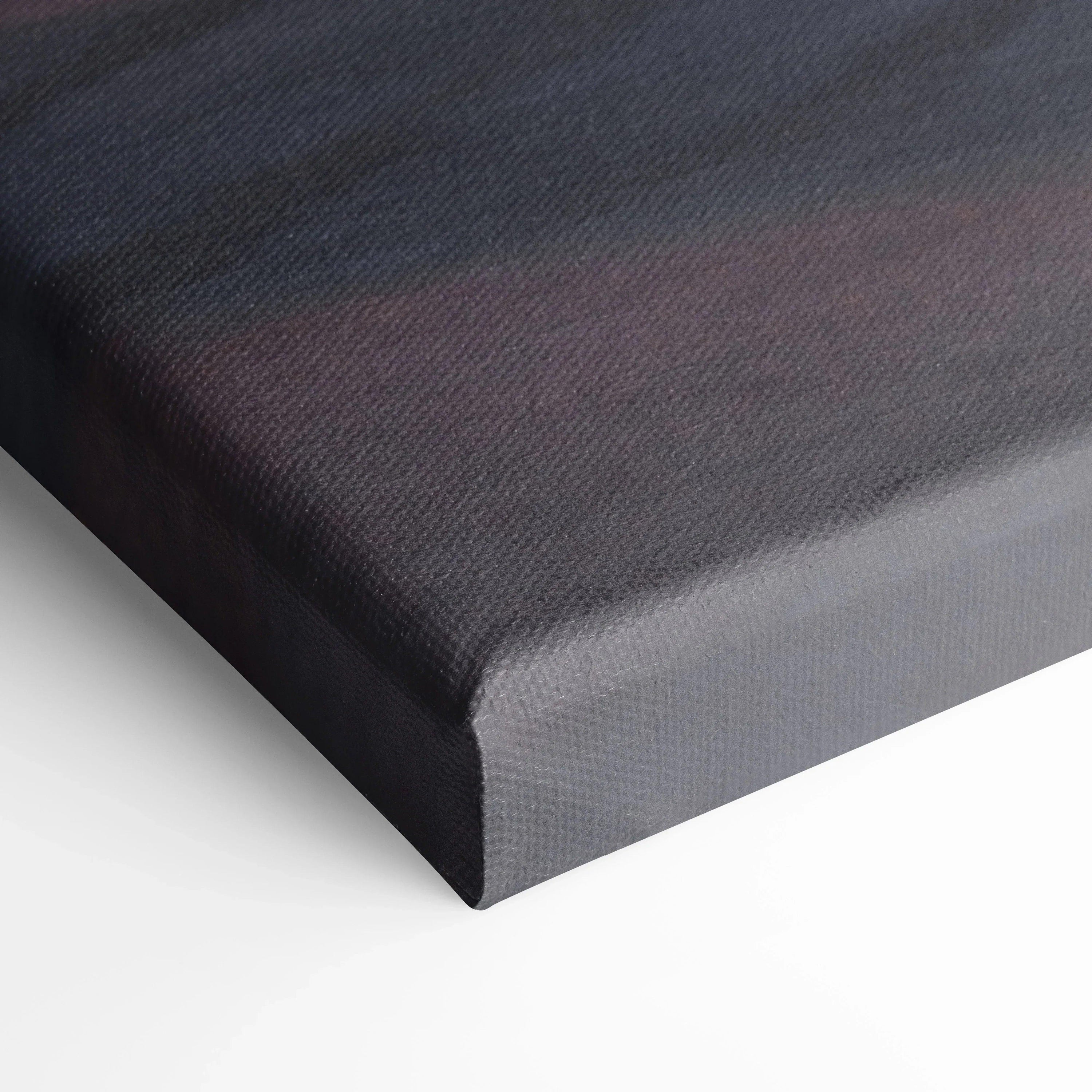 Close-up of textured black canvas corner showing fine weave for wall art print.