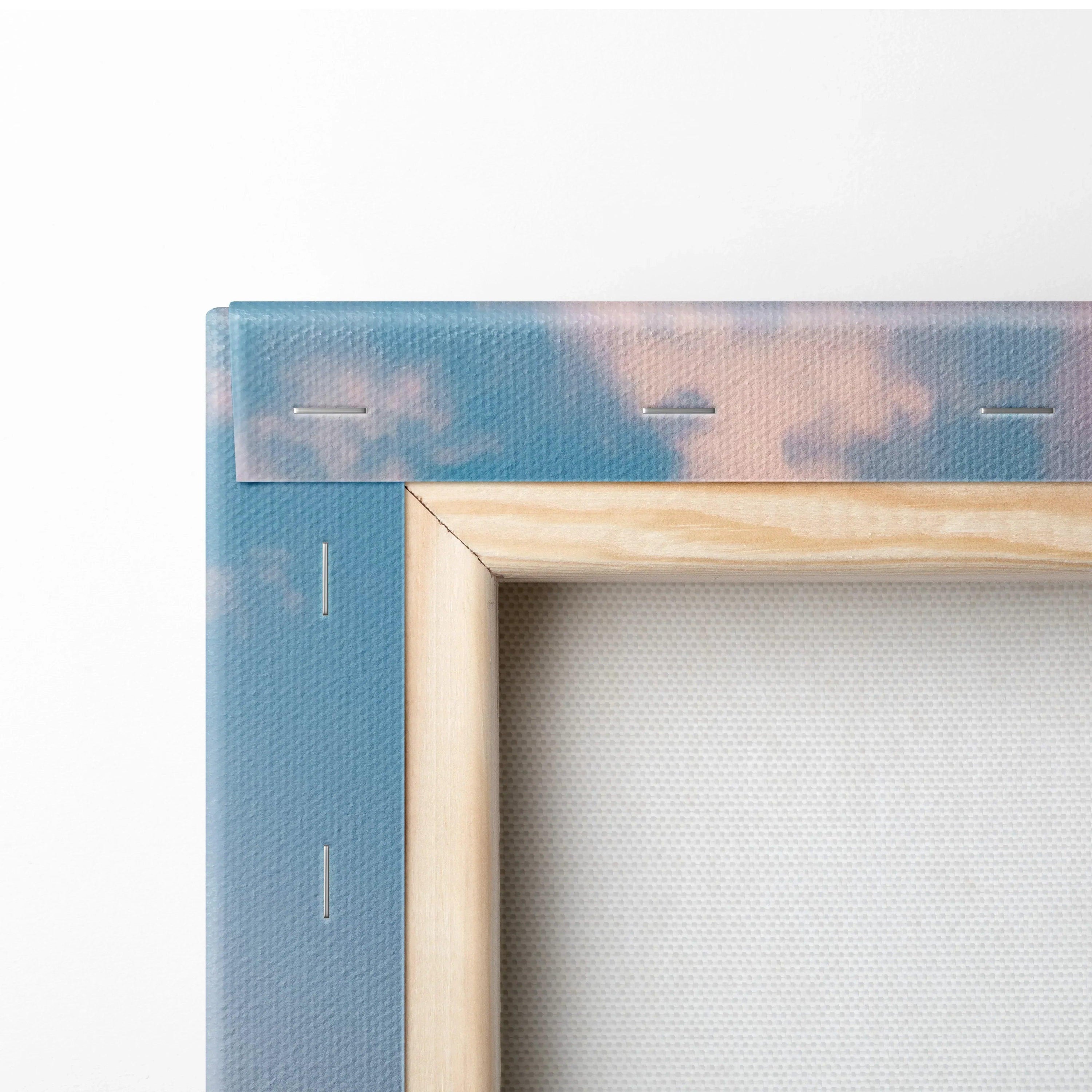 Close-up of wooden frame corner and canvas fabric with soft blue and pink sky, canvas wall art detail.