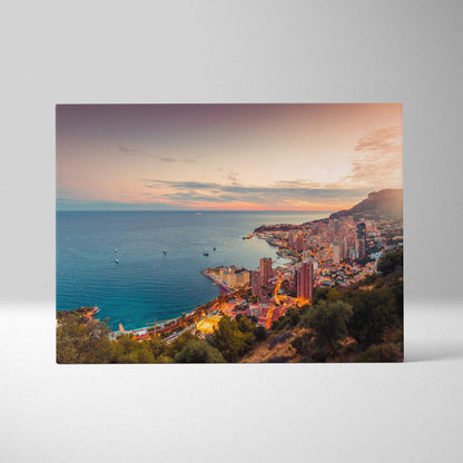 Canvas wall art featuring a vibrant coastal cityscape at sunset with buildings and water.