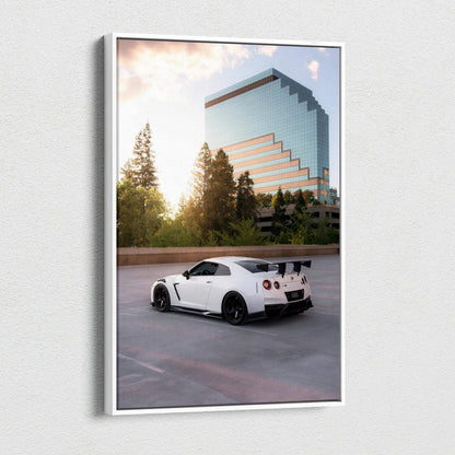 White Nissan GTR R35 parked near trees and modern glass building vertical canvas wall art.