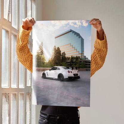 Nissan GTR R35 parked in front of modern building with trees poster wall art.