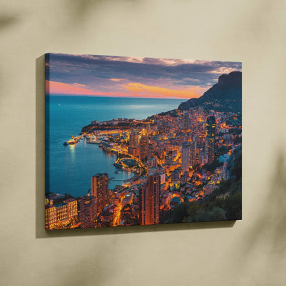 Canvas wall art featuring a vibrant coastal cityscape at sunset with illuminated buildings and deep blue sea.