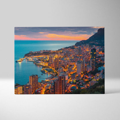 Canvas wall art featuring a vibrant evening cityscape with illuminated buildings along a coastal hillside under a colorful.