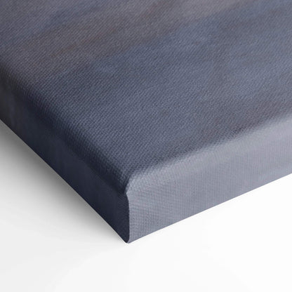Close-up of textured canvas corner with a gradient blue and gray finish for wall art.