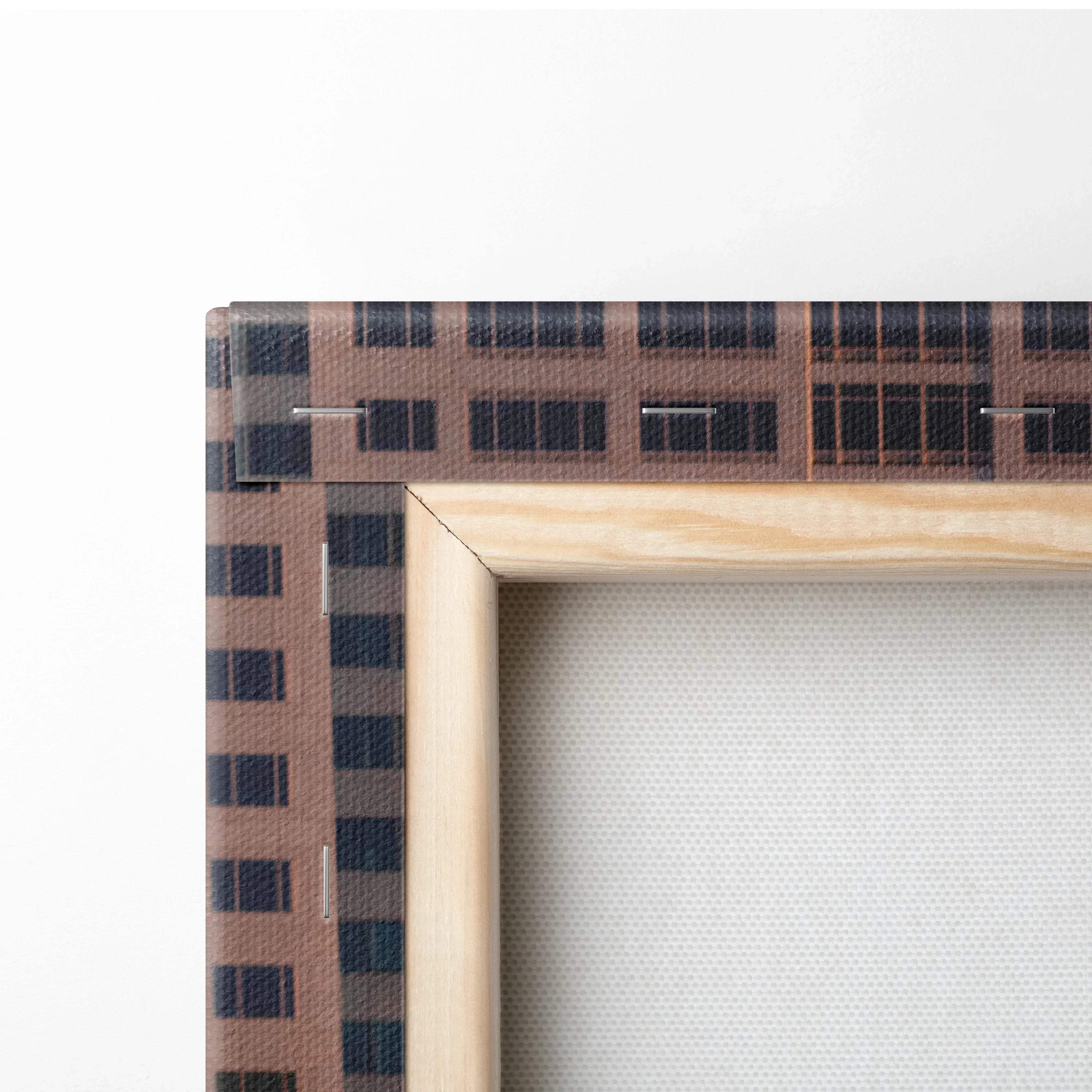 Close-up of stretched canvas with natural wood frame, showcasing textured wall art material.