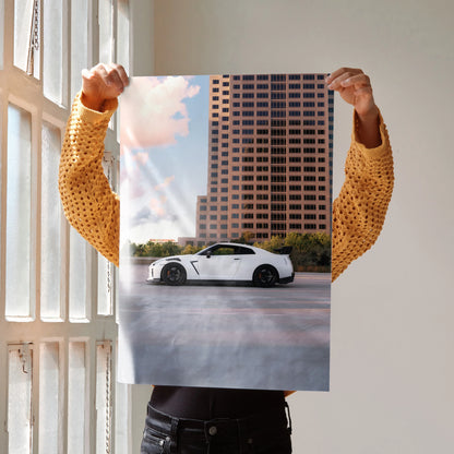 Nissan GTR R35 parked in front of a tall building at sunset, high resolution car poster wall art.