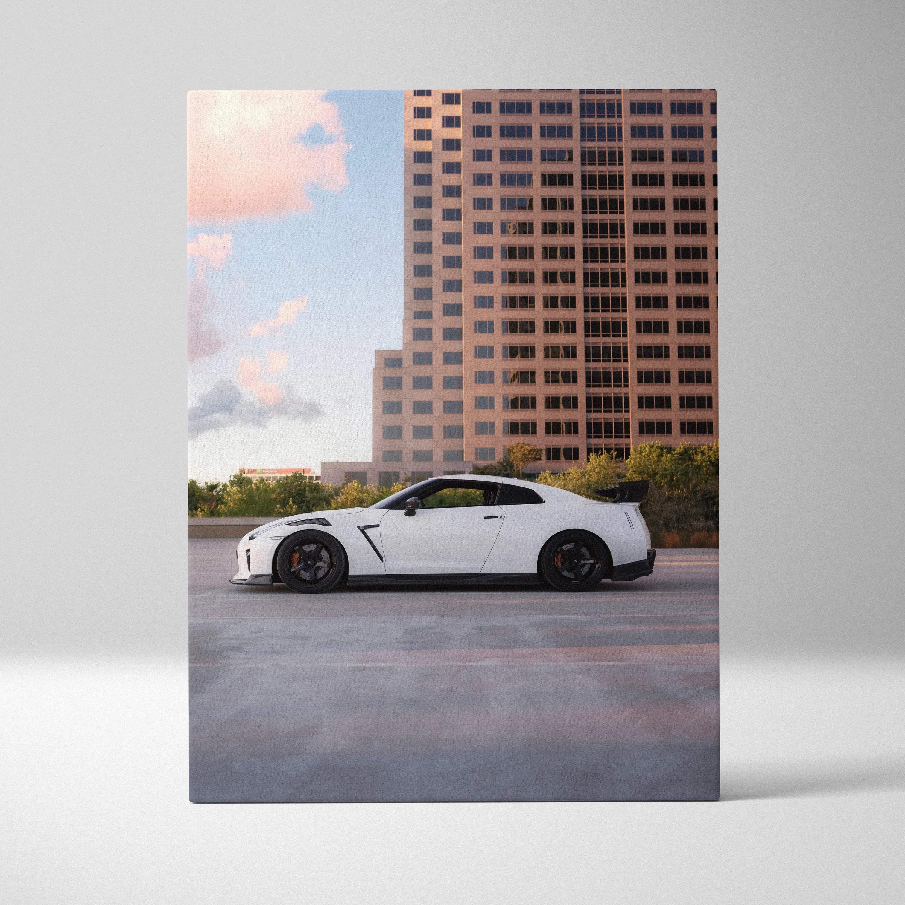 White Nissan GTR R35 parked in front of tall building canvas wall art print.