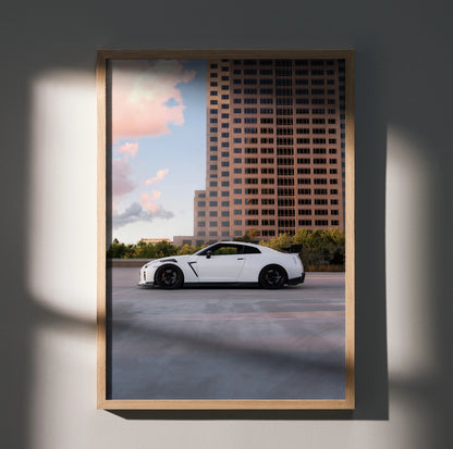 Nissan GTR R35 white sports car parked with cityscape background poster wall art.