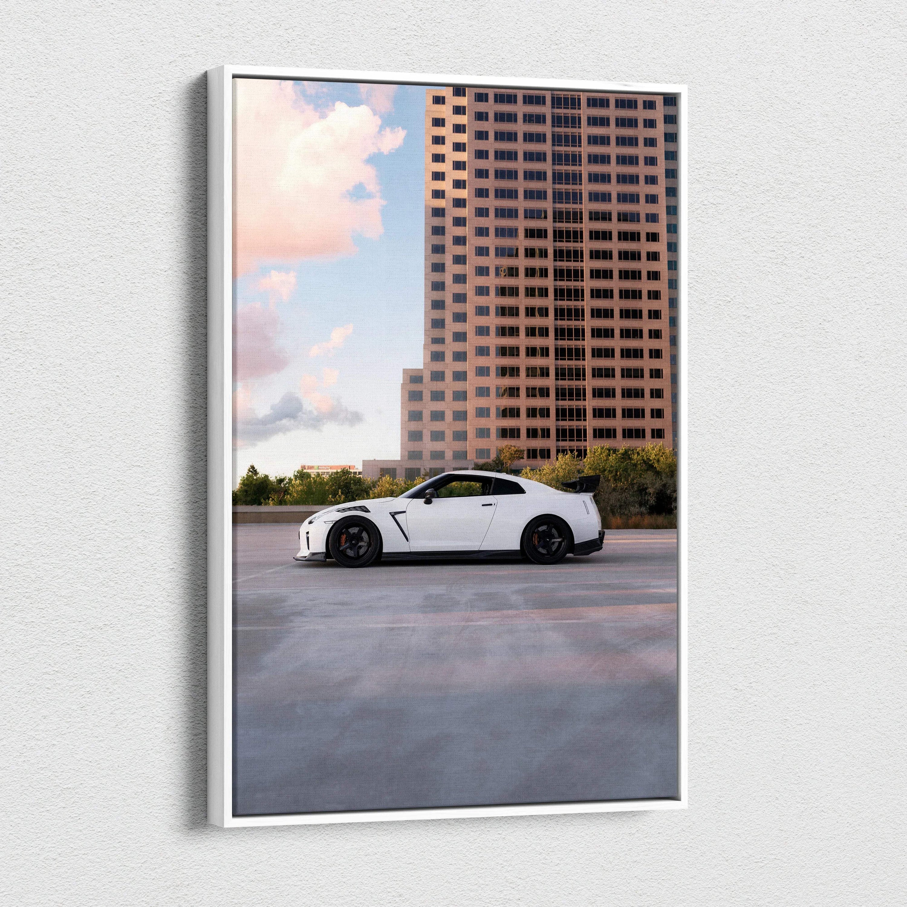 Vertical canvas wall art featuring a white Nissan GTR R35 against a city skyline at sunset.