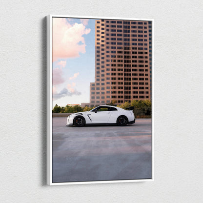 Vertical canvas wall art featuring a white Nissan GTR R35 against a city skyline at sunset.