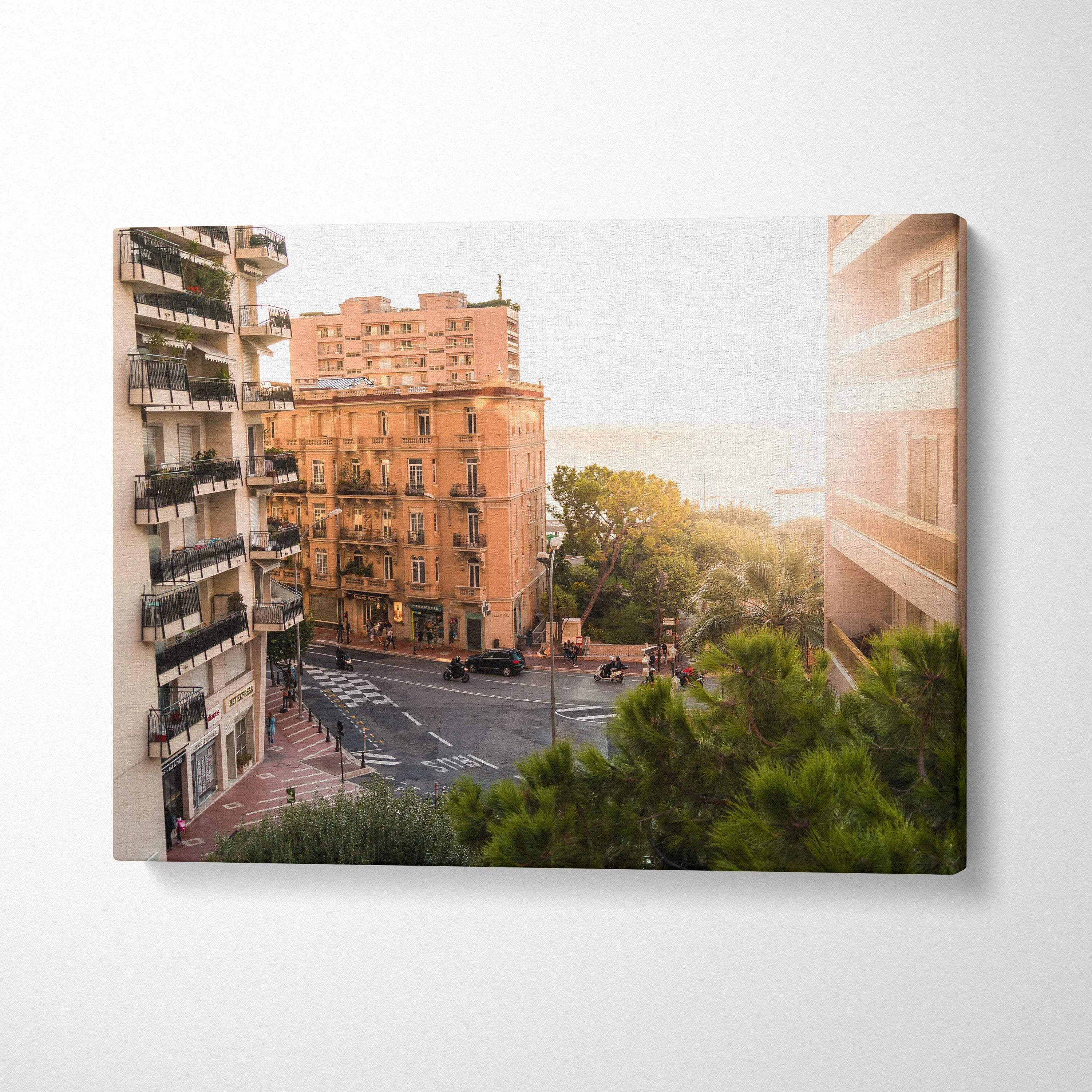Canvas wall art featuring warm-toned urban architecture and sunlit cityscape with greenery in foreground.