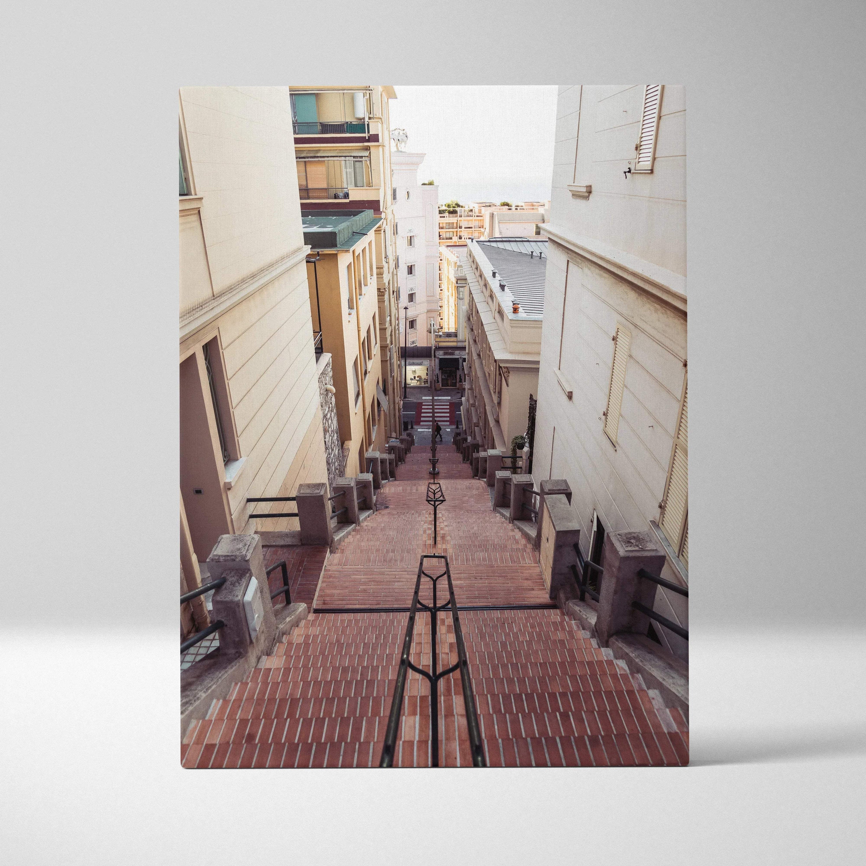 Vertical canvas wall art featuring a narrow brick staircase between tall buildings in a cityscape.