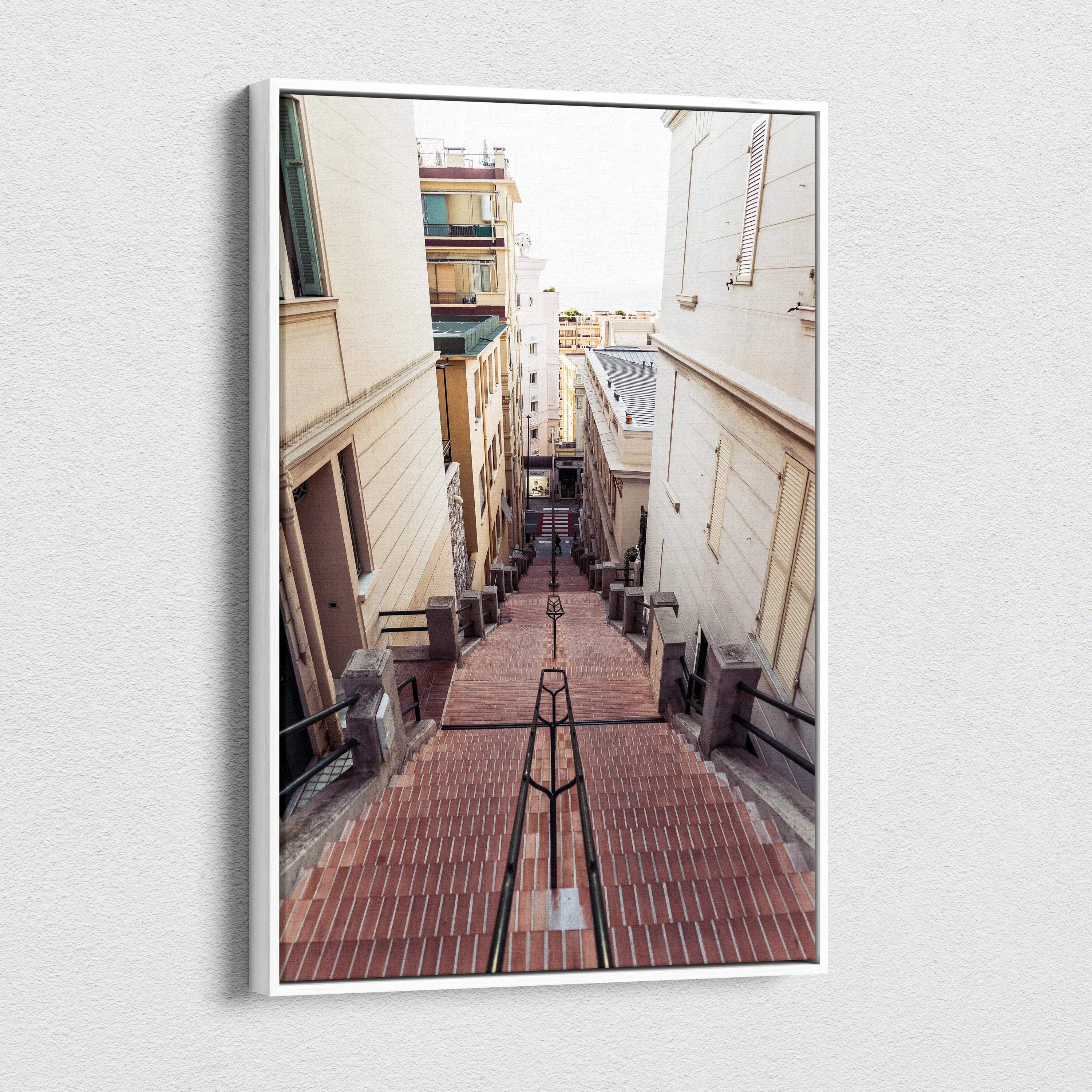 Vertical canvas wall art featuring a narrow urban alleyway with warm-toned buildings and stairs leading downward.