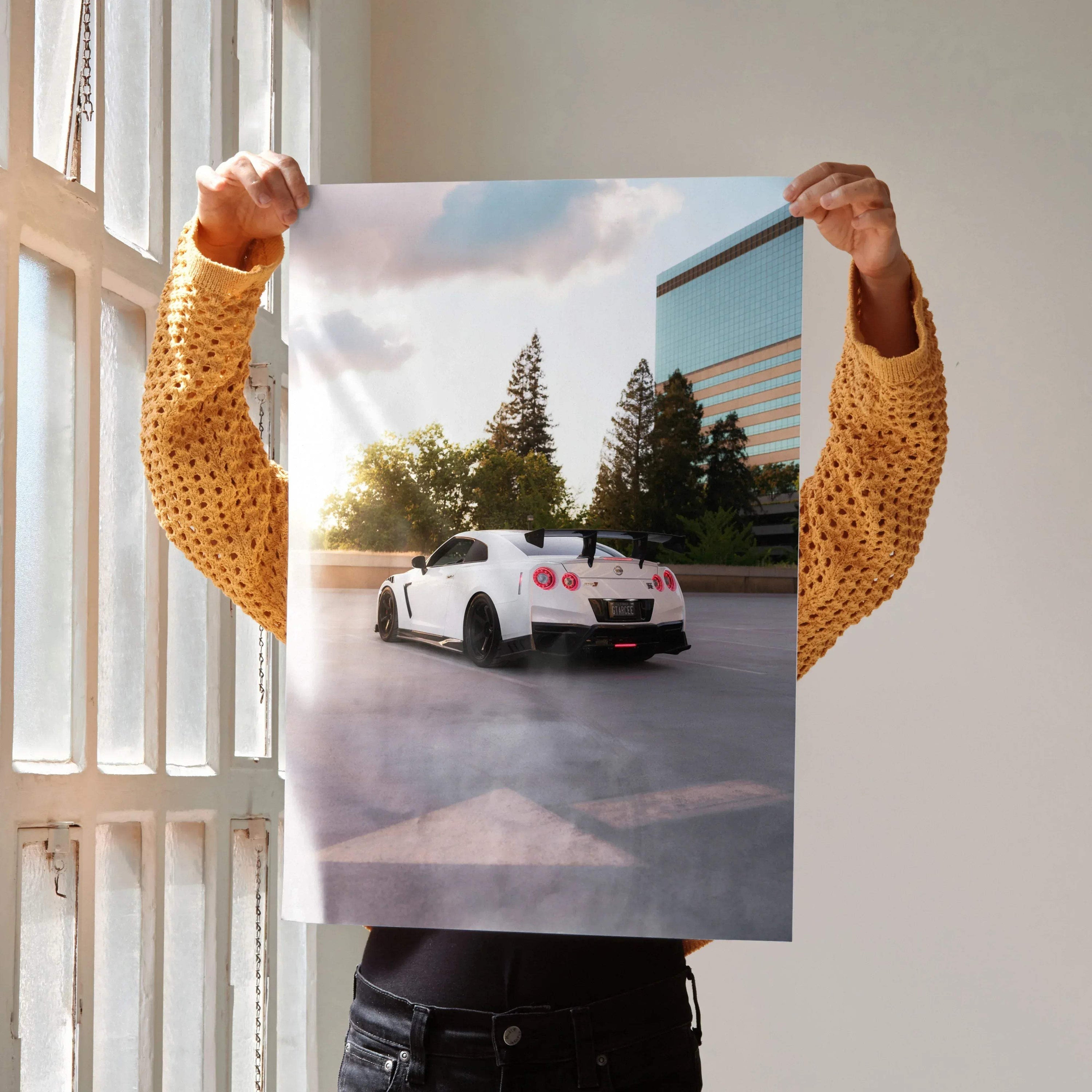 Nissan GTR R35 white car parked near trees and building at sunset poster wall art.