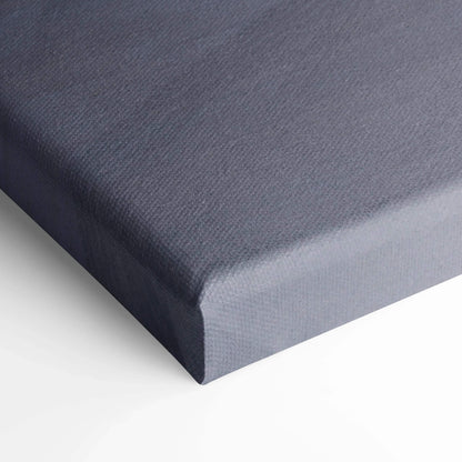 Close-up of gray textured canvas corner on white background, showcasing museum-quality wall art surface.