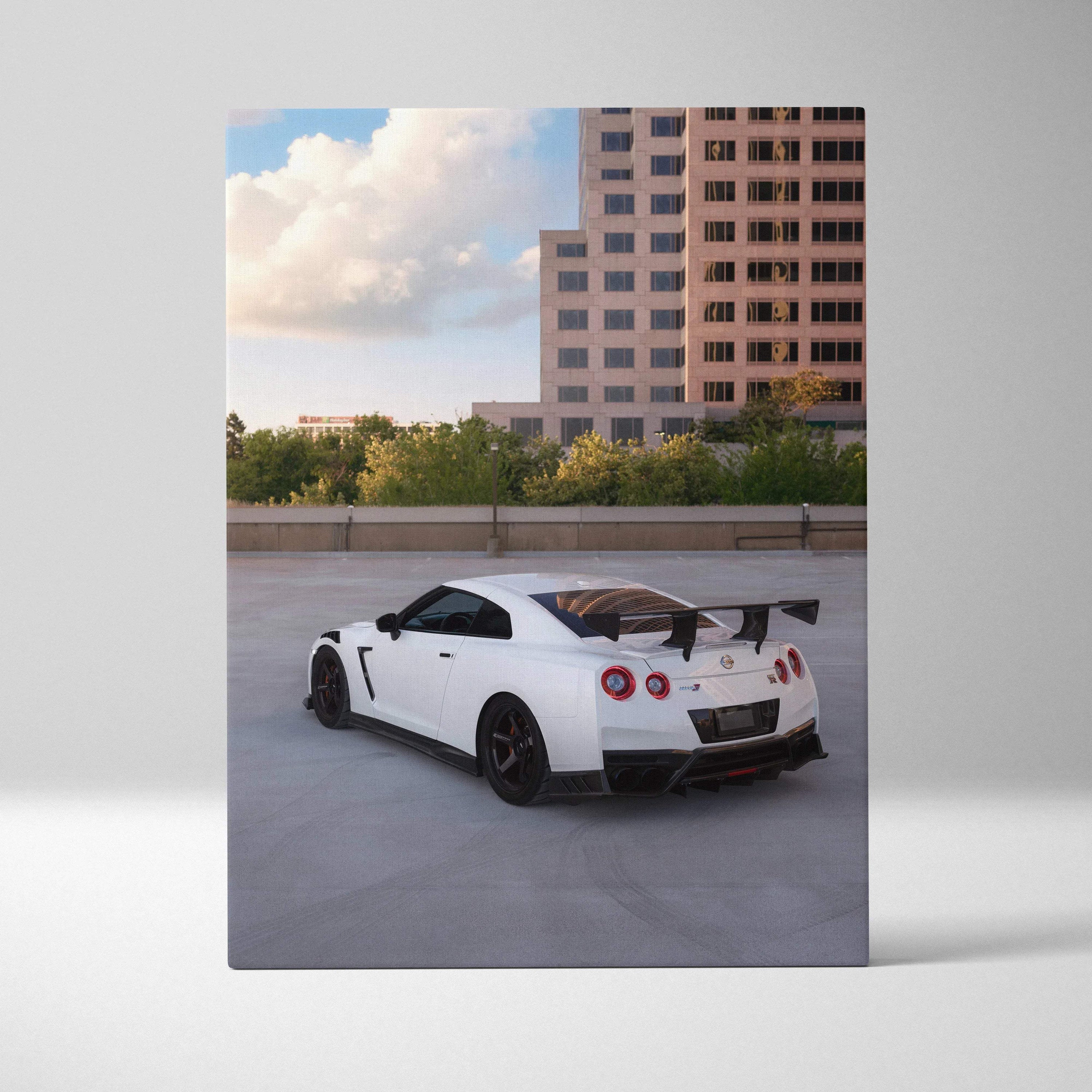 White Nissan GTR R35 with black spoiler parked in urban rooftop scene vertical canvas art.