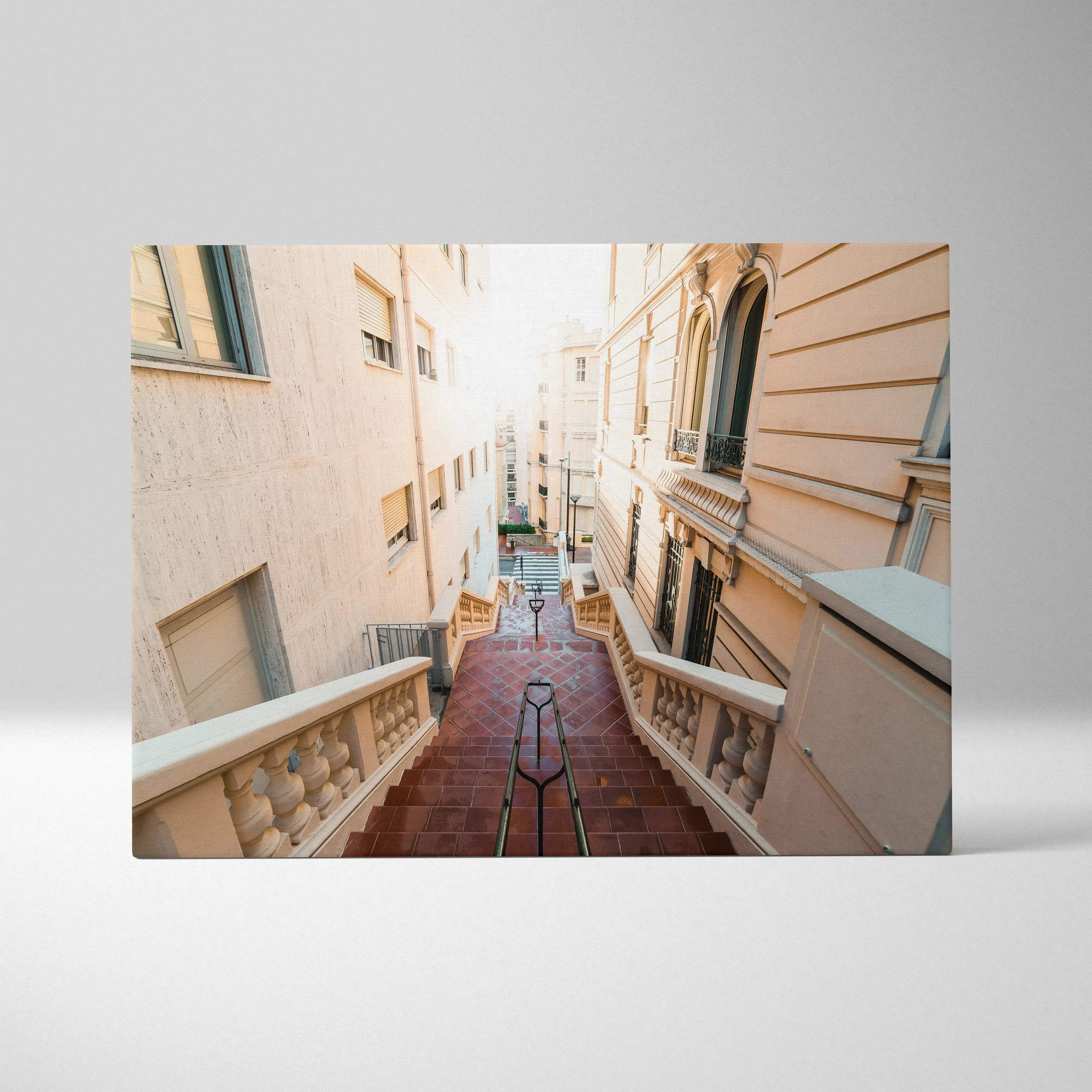 Canvas art wall decor featuring a sunlit narrow European street with stairs and classic buildings.