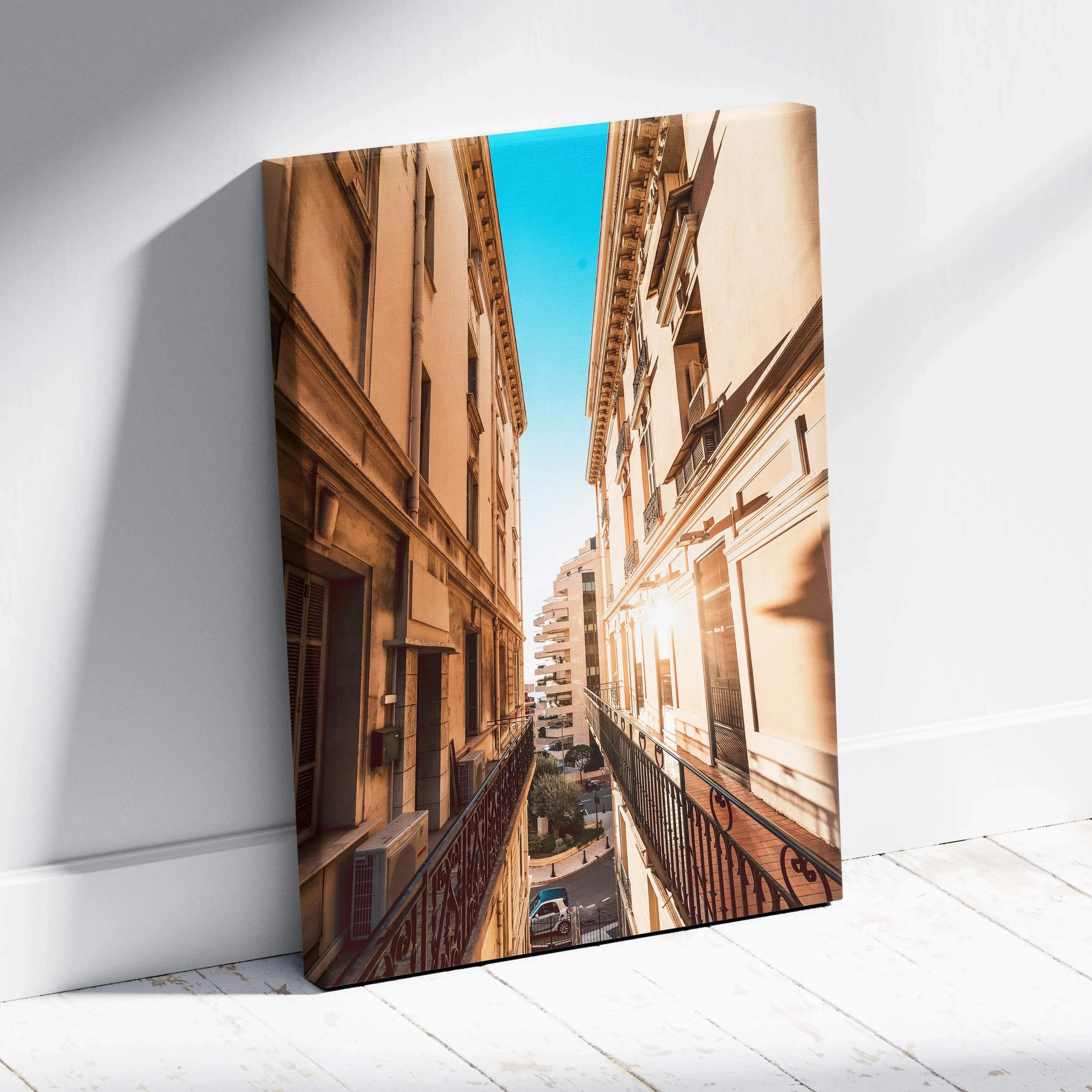 Rectangular canvas wall art featuring a warm golden hour european street with sunlight and shadows on buildings