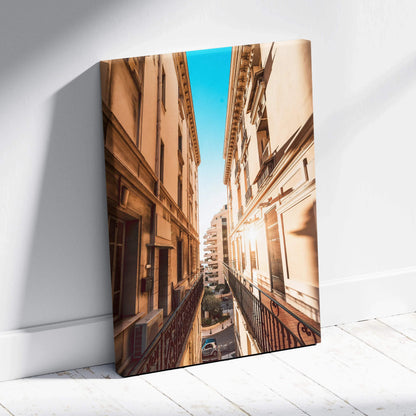 Tall beige building architecture captured in warm light, printed on stretched canvas wall art.