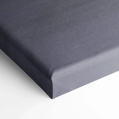 Gray textured canvas stretched over wooden frame, vertical wall art canvas print close-up.