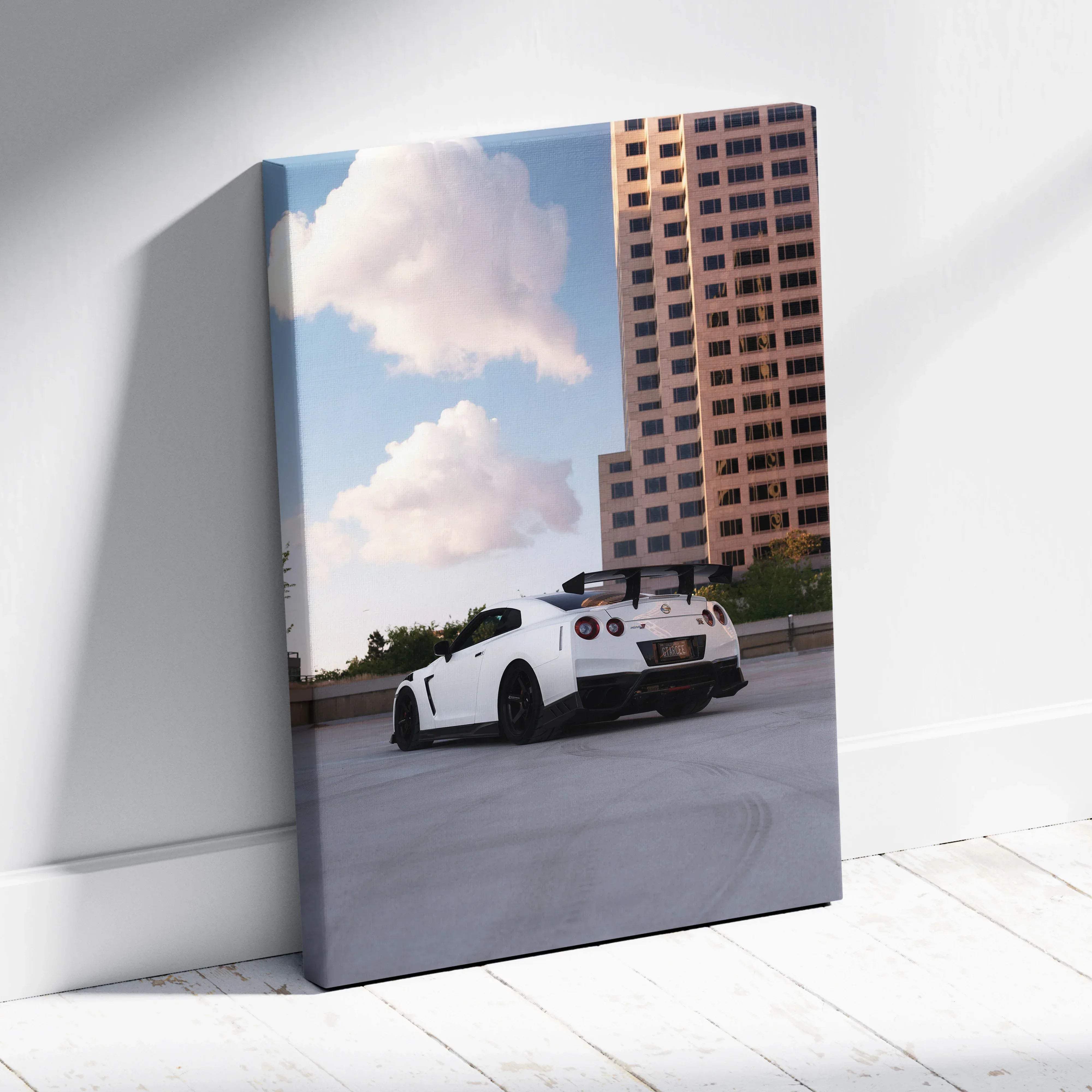 White nissan gt-r r35 canvas wall art featuring a sleek sports car on rooftop with city buildings and clouds background