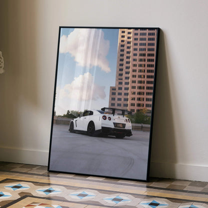 Nissan GTR R35 white sports car poster leaning against wall with urban building background wall art.