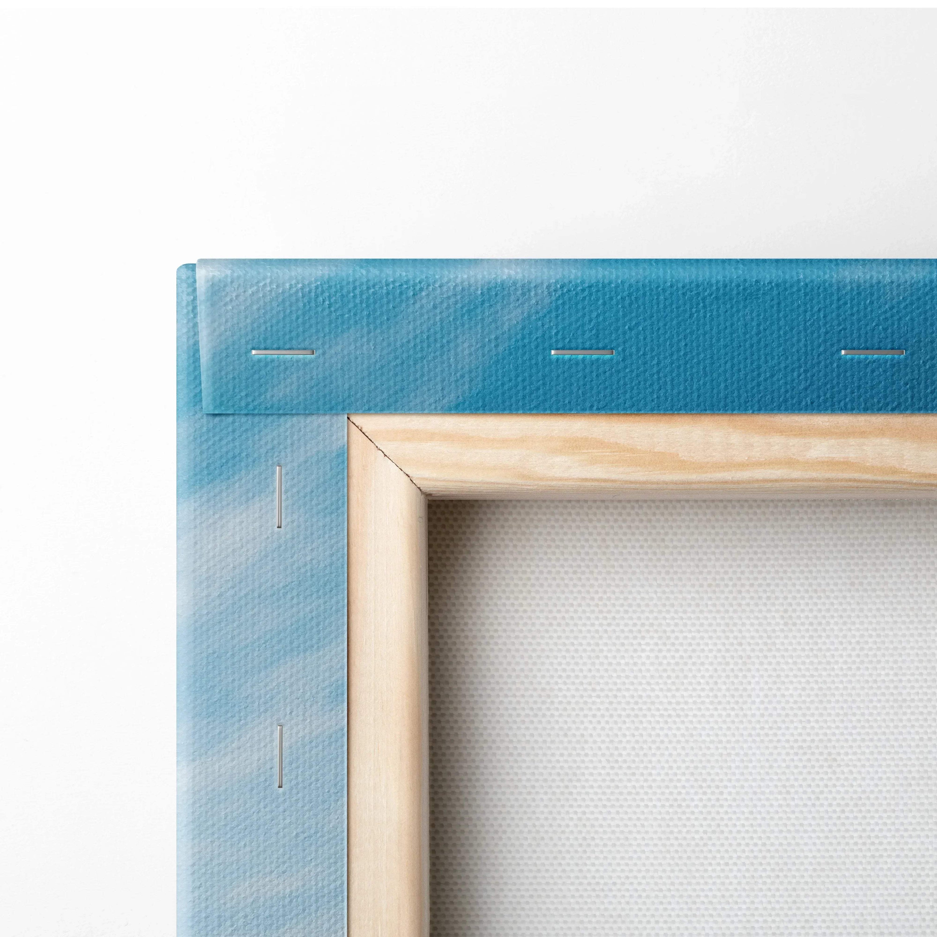 Close-up of blue stretched canvas with visible wooden frame and metal staples for modern wall art print.